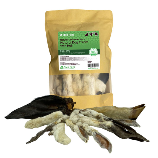 A bag of Stelr Pets natural treats with hair titled 'Natural Dewormer Pack', and a selection of natural treats including rabbit ears with fur, rabbit feet, buffalo ear and lamb foot. 