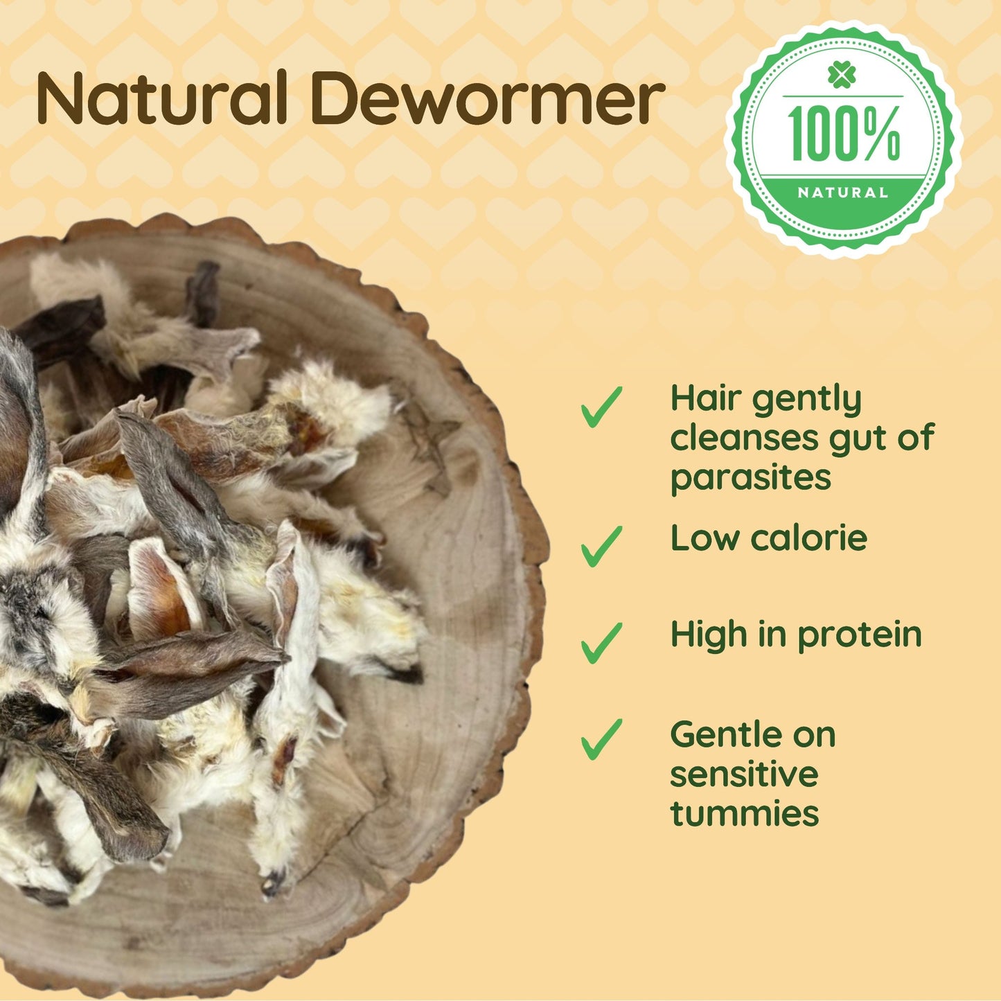 The image shows a selection of rabbit ears with fur positioned over a piece of natural wood. Bullet points to the right of the image explain how furry rabbit ears are beneficial to dogs: 'Hair gently cleanses gut of parasites', 'Low calorie', 'High in protein' and 'Gentle on sensitive tummies'. 