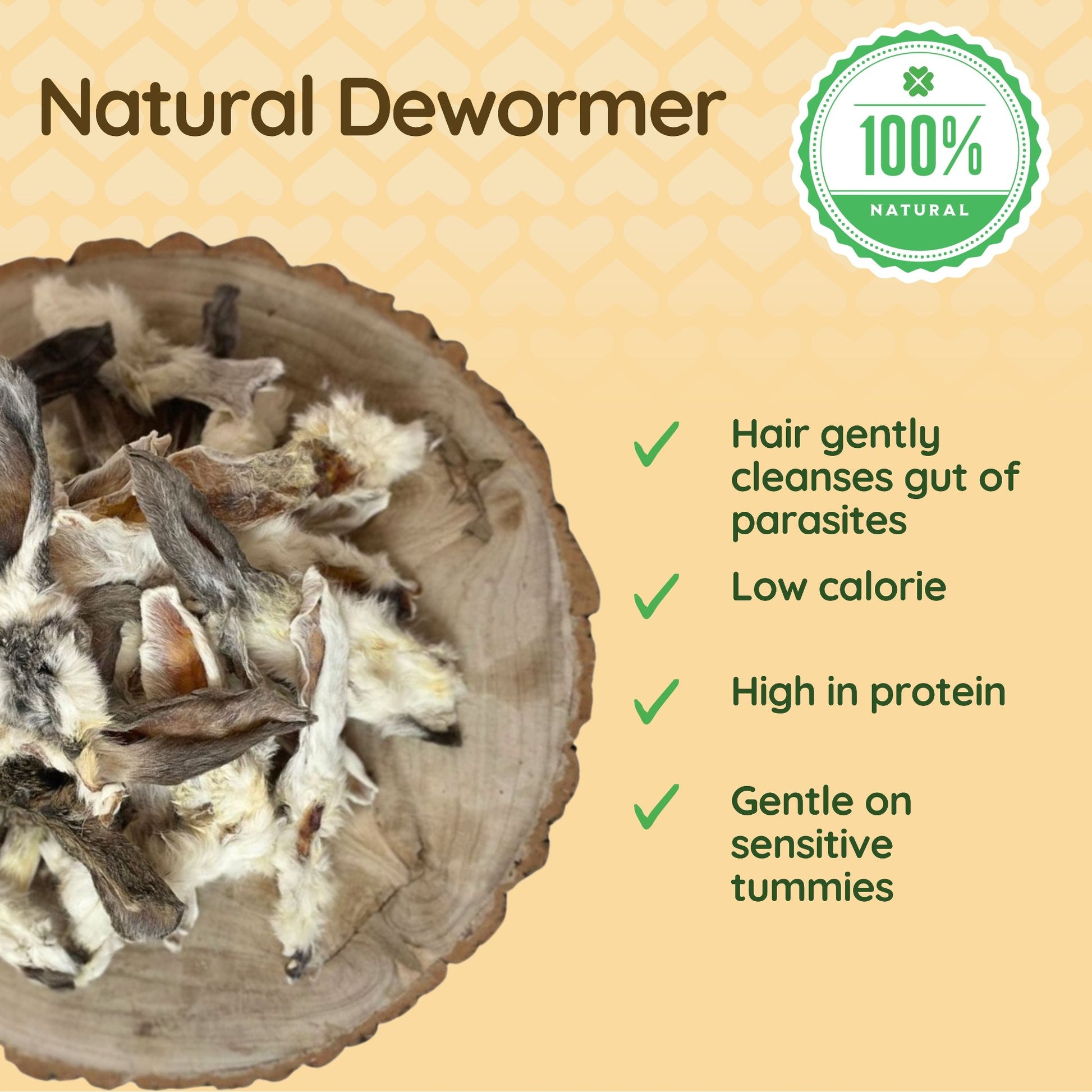 The image shows a selection of rabbit ears with fur positioned over a piece of natural wood. Bullet points to the right of the image explain how furry rabbit ears are beneficial to dogs: 'Hair gently cleanses gut of parasites', 'Low calorie', 'High in protein' and 'Gentle on sensitive tummies'. 