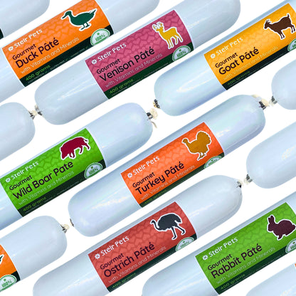 The image shows a selection of Stelr Pets Gourmet Pates in duck, venison, wild boar, goat, turkey, ostrich and rabbit flavours.  